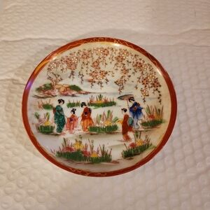 Elegant Asian-Inspired Decorative Plate with Red and Multicolor Design